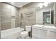 Clean bathroom with tub, tiled walls, and sleek vanity at 2676 Cottonwood Dr, Marietta, GA 30066