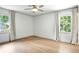 Bright bedroom with neutral walls, hardwood floors, and large windows with curtains at 2676 Cottonwood Dr, Marietta, GA 30066