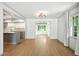 Elegant dining room with hardwood floors flowing to a modern kitchen at 2676 Cottonwood Dr, Marietta, GA 30066