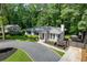 Charming front exterior featuring a well-manicured lawn and brick accents at 2676 Cottonwood Dr, Marietta, GA 30066
