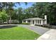 Beautiful single-story home featuring a manicured front lawn and a long driveway at 2676 Cottonwood Dr, Marietta, GA 30066