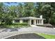 Charming home with a white exterior, a manicured lawn, and mature trees at 2676 Cottonwood Dr, Marietta, GA 30066