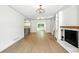 Open concept living room featuring a fireplace and hardwood floors at 2676 Cottonwood Dr, Marietta, GA 30066