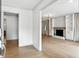 Bright living room featuring hardwood floors and a fireplace with custom built-ins at 2676 Cottonwood Dr, Marietta, GA 30066