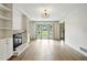 Inviting living room showcasing hardwood floors, a fireplace, and natural light at 2676 Cottonwood Dr, Marietta, GA 30066