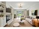 Tastefully decorated living room with a fireplace, built-in shelves, and ample seating at 2676 Cottonwood Dr, Marietta, GA 30066
