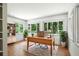 Well lit office features hardwood floors, a wooden desk and view of nature at 2676 Cottonwood Dr, Marietta, GA 30066
