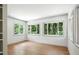 Bright, empty room with lots of windows and hardwood floors is ready to be occupied at 2676 Cottonwood Dr, Marietta, GA 30066