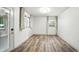 Inviting room featuring wood-look floors, natural light, and a door to the backyard at 2676 Cottonwood Dr, Marietta, GA 30066