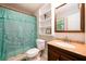 Bathroom with decorative shower curtain, granite vanity top, and framed mirror at 3645 Shrewsbury Ct, Snellville, GA 30039