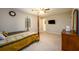 Spacious bedroom with a four-poster bed, mounted TV, and a dresser with mirror at 3645 Shrewsbury Ct, Snellville, GA 30039