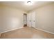 Bedroom with neutral walls, carpet, a ceiling light and a closet at 3645 Shrewsbury Ct, Snellville, GA 30039