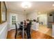 Cozy dining area with glass table set with backyard access and tile flooring at 3645 Shrewsbury Ct, Snellville, GA 30039