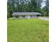 A well-maintained single-story home with a covered carport and spacious front yard at 3645 Shrewsbury Ct, Snellville, GA 30039