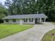 Charming single-story home with a long driveway and covered parking at 3645 Shrewsbury Ct, Snellville, GA 30039