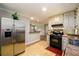 Updated kitchen with stainless steel appliances and a breakfast bar at 3645 Shrewsbury Ct, Snellville, GA 30039