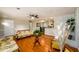 Open-concept living area with hardwood floors, stone fireplace, and view into dining and kitchen at 3645 Shrewsbury Ct, Snellville, GA 30039