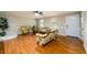 Inviting living room featuring hardwood floors and a charming decorative stone fireplace at 3645 Shrewsbury Ct, Snellville, GA 30039