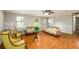 Bright living room with hardwood floors, neutral walls, and classic furniture arrangement at 3645 Shrewsbury Ct, Snellville, GA 30039