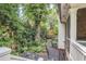 Secluded backyard featuring lush landscaping, gravel path, and mature trees at 377 Camden Ne Rd, Atlanta, GA 30309