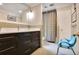 Bathroom boasting a double vanity, neutral tile, and modern fixtures at 377 Camden Ne Rd, Atlanta, GA 30309