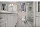 Bright bathroom with white cabinets, marble countertop, and glass shower at 377 Camden Ne Rd, Atlanta, GA 30309