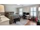 Comfortable bedroom features hardwood floors, neutral walls, and a desk area with dual monitors at 377 Camden Ne Rd, Atlanta, GA 30309