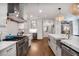 Bright kitchen with stainless appliances, white cabinets, and a large marble island at 377 Camden Ne Rd, Atlanta, GA 30309