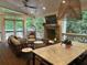 Inviting outdoor living space featuring a fireplace, comfortable seating, and dining area at 377 Camden Ne Rd, Atlanta, GA 30309