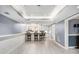 Finished basement featuring decorative wainscoting, bar seating and recessed lighting at 1155 Admiral Xing, Alpharetta, GA 30005