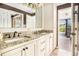 The bathroom features dual sinks with granite counters, tile floors, and opens to the guest bedroom at 1155 Admiral Xing, Alpharetta, GA 30005