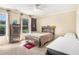 Comfortable bedroom featuring stylish wood furniture and bright natural light at 1155 Admiral Xing, Alpharetta, GA 30005
