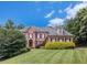 Beautiful brick home with a manicured lawn and mature trees at 1155 Admiral Xing, Alpharetta, GA 30005