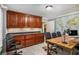 Spacious home office featuring built-in storage and a large work desk at 1155 Admiral Xing, Alpharetta, GA 30005