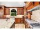 Gourmet kitchen with custom cabinets, granite countertops, and stainless steel appliances at 1155 Admiral Xing, Alpharetta, GA 30005