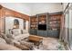 Comfortable living room with built-in shelves, wood trim and large windows at 1155 Admiral Xing, Alpharetta, GA 30005