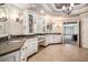 The primary bath features dual sinks, granite counters, tile floors, and easy access to the primary bedroom at 1155 Admiral Xing, Alpharetta, GA 30005