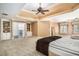 Spacious main bedroom boasts a tray ceiling, plush carpet, and a cozy reading nook with natural light at 1155 Admiral Xing, Alpharetta, GA 30005