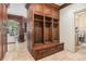 Mudroom with custom built-in lockers and a view into the laundry room at 1155 Admiral Xing, Alpharetta, GA 30005