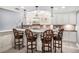 Basement wet bar featuring bar seating, pendant lighting, and decorative backsplash at 1155 Admiral Xing, Alpharetta, GA 30005