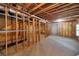 Unfinished basement with exposed beams and concrete floor at 4321 Clairesbrook Ln, Acworth, GA 30101
