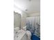 Clean bathroom with a single vanity, toilet, shower with curtain, and natural lighting at 4321 Clairesbrook Ln, Acworth, GA 30101