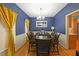 Elegant dining room with a large table, sophisticated decor, and natural light at 4321 Clairesbrook Ln, Acworth, GA 30101