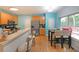 Spacious kitchen featuring modern appliances, a breakfast bar, and adjacent dining area at 4321 Clairesbrook Ln, Acworth, GA 30101