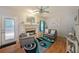 Comfortable living room with a fireplace, hardwood floors, and lots of light at 4321 Clairesbrook Ln, Acworth, GA 30101