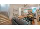 Open-concept living room with hardwood floors and a staircase, offering seamless flow to the kitchen at 4321 Clairesbrook Ln, Acworth, GA 30101