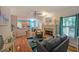 Bright open-plan living room with hardwood floors, fireplace, and kitchen access at 4321 Clairesbrook Ln, Acworth, GA 30101