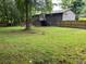 Large, grassy backyard enclosed by a wooden fence, ideal for outdoor activities and relaxation at 4325 Dawning Ln, Douglasville, GA 30135