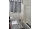 A tidy bathroom with a sink with granite countertop and a shower and tub combo at 4325 Dawning Ln, Douglasville, GA 30135