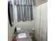 Stylish bathroom featuring granite countertop, round mirror, and updated shower at 4325 Dawning Ln, Douglasville, GA 30135